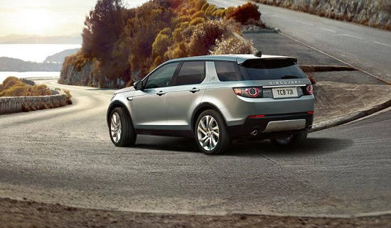 Land Rover Discovery driving on a winding road