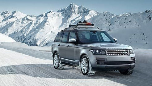Range Rover driving through snow