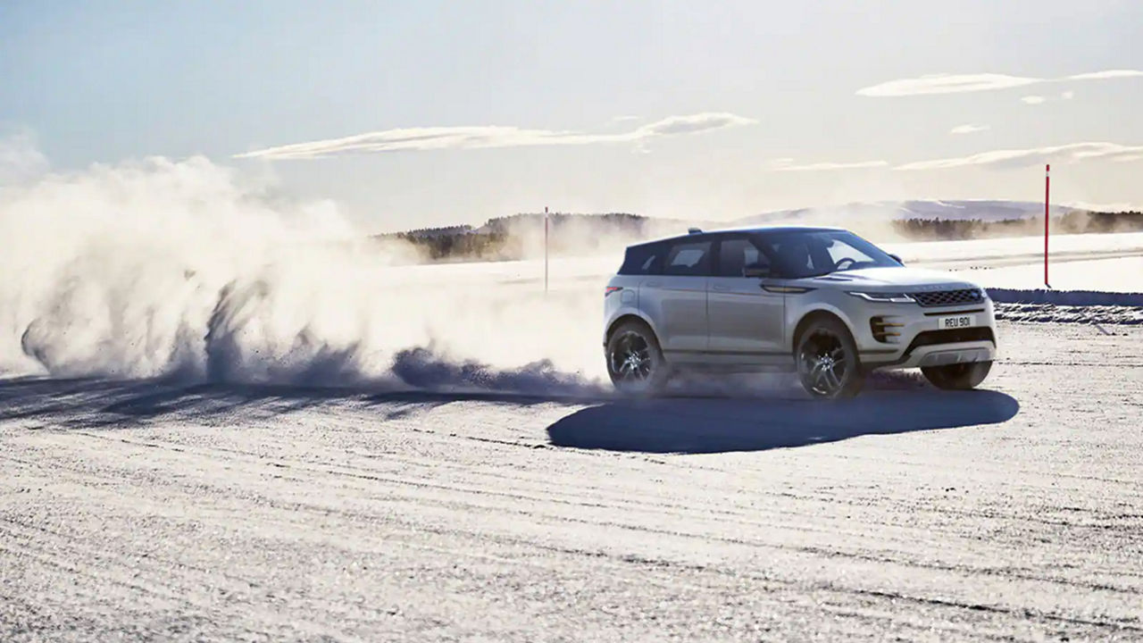 Range Rover Evoque driving through snow