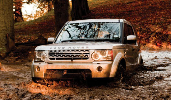 Land Rover vehicle driving through water