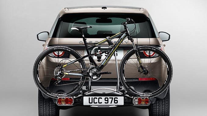 Range Rover Discovery with bike behind