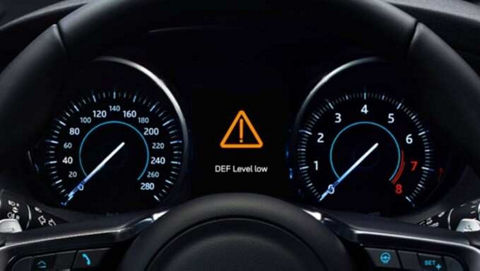 Close up of Jaguar F-Pace dashboard and steering wheel.