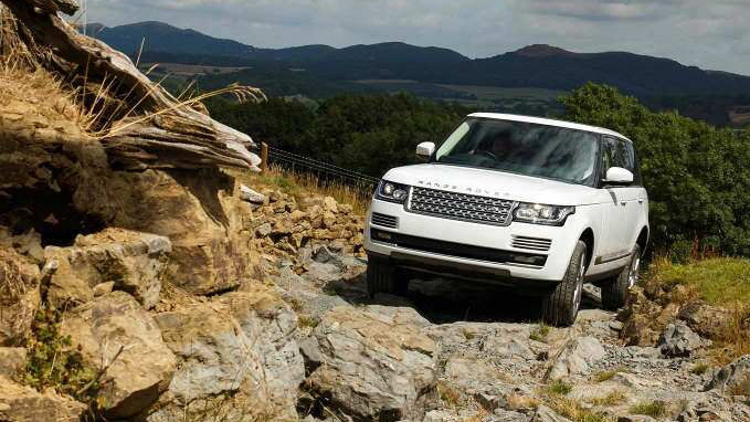 Range Rover driving on terrain 