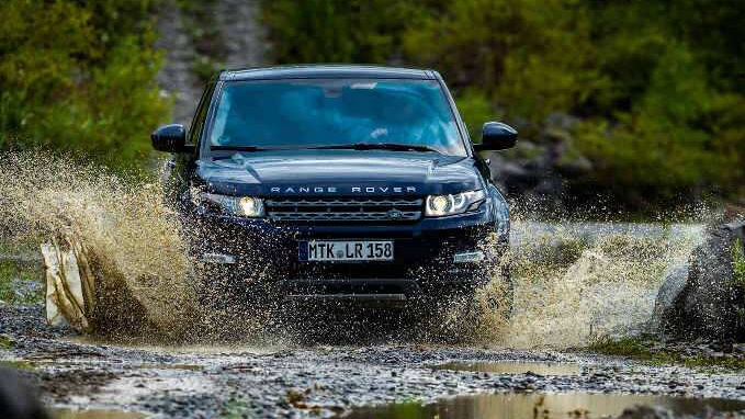 Range Rover driving through water