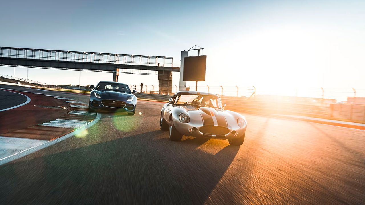 Jaguar classic Cars E-Type running on racing track