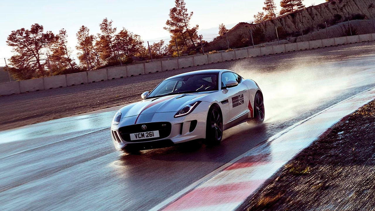 Jaguar F-Type running on racing track