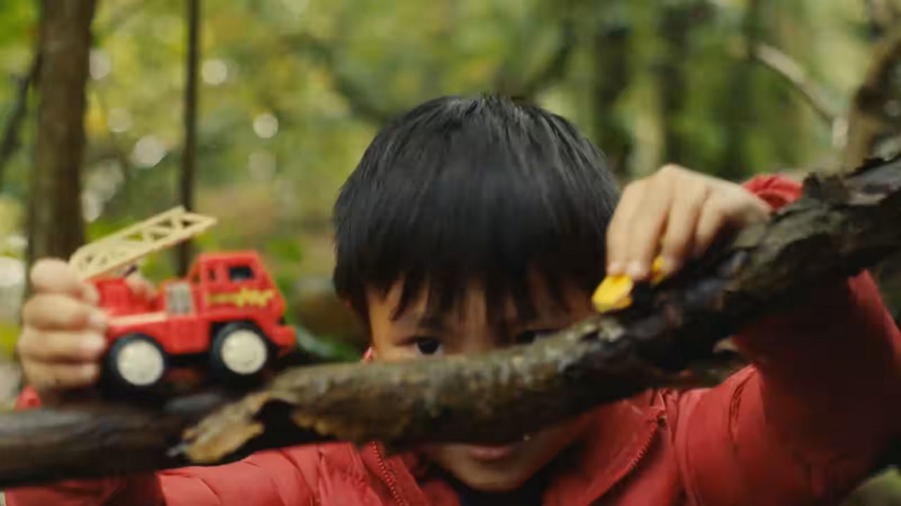 Child playing with toy truck