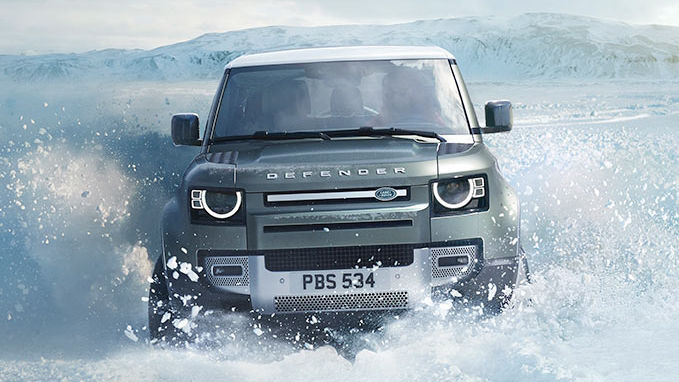 Land Rover Defender driving through water