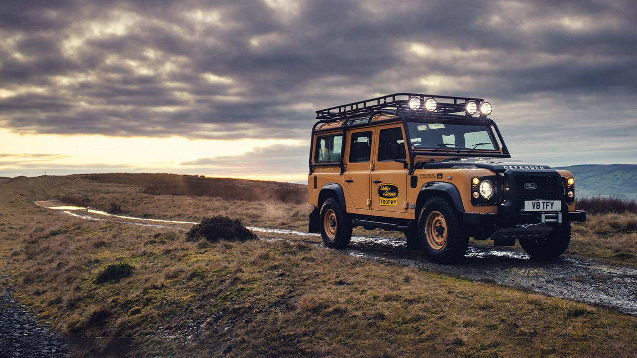 Land Rover Defender Works V8 Trophy parked on gravel path