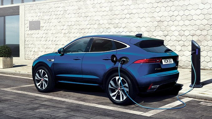 Blue JAGUAR charging at charging point