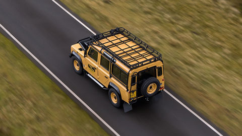 Classic Land Rover Driving on road