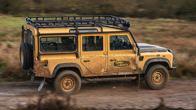 Land Rover Defender Works V8 Trophy driving on muddy road