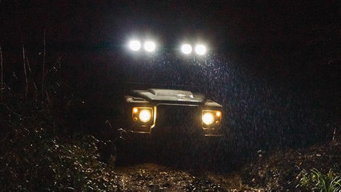 Land Rover Defender Works V8 Trophy headlamps at night 