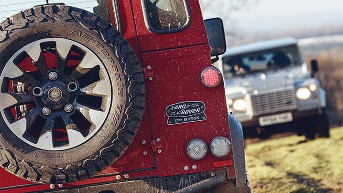 Close up of Land Rover Defender Works V8 70th edition badge and spare wheel