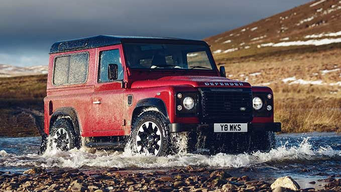 Land Rover Defender Works V8 driving through water