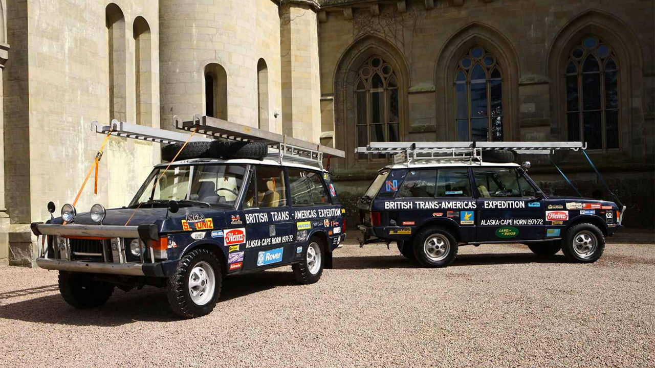 1972 Range Rovers parked in front of buildings 