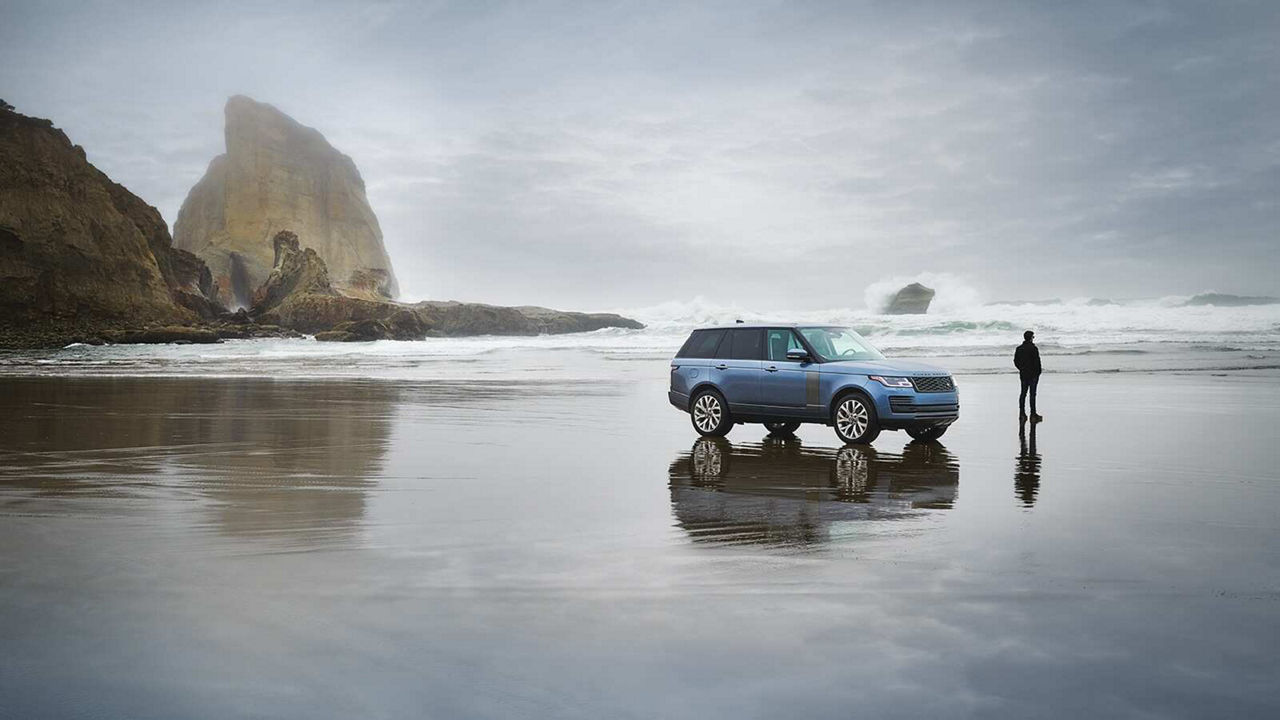 Land Rover vehicle parked into water