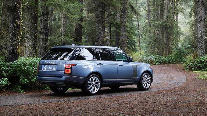 Range Rover HSE driving in forest