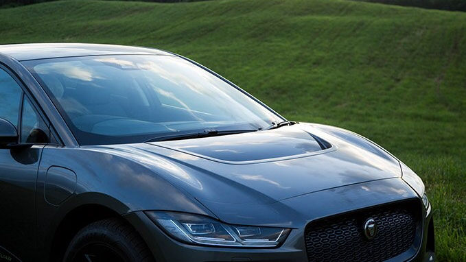 a Jaguar I-Pace car in the fields