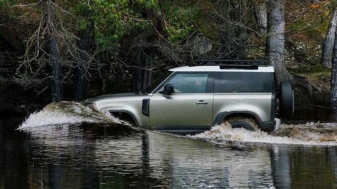 John Mayer Land Rover Defender in river