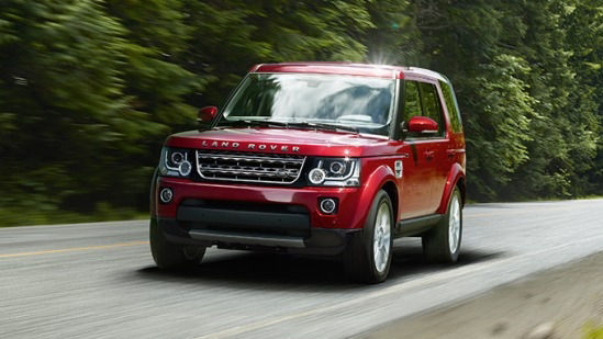 Land Rover driving on forest road