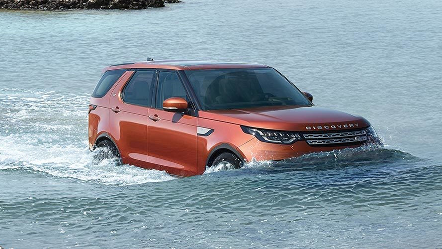 Land Rover Discovery driving through water