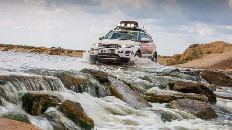 Range Rover driving through water