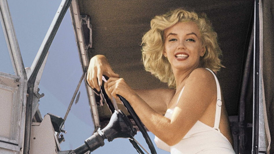 Portrait of Marilyn Monroe driving Land Rover