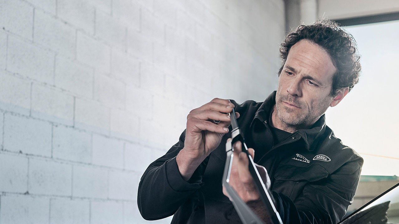 Male professional repairs a wifer