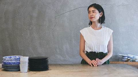 Women standing near Table