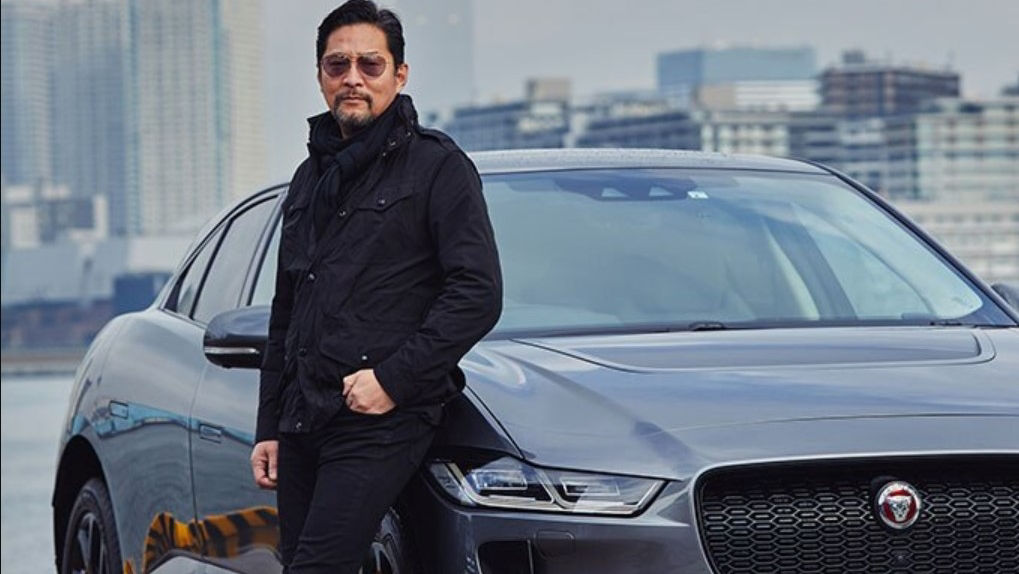 Black Suit Man With JAGUAR In Seashore