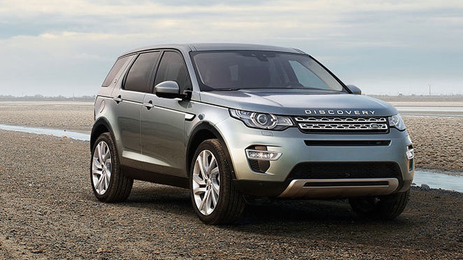 Land Rover Discovery parked by river 