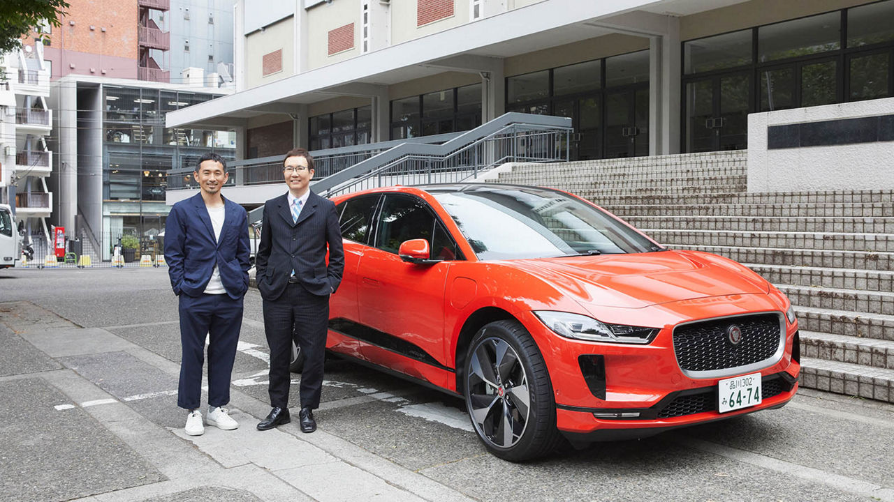 Mr Fukuoka and Mr Tamesue in front of a Jaguar I-Pace