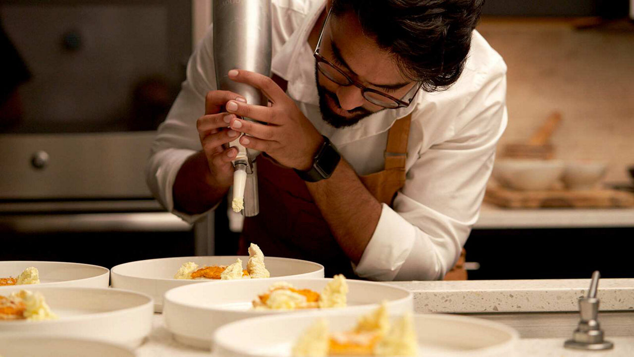 Putting finishing touches on dessert