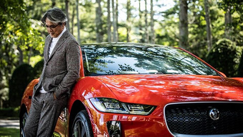 man in-front of orange JAGUAR