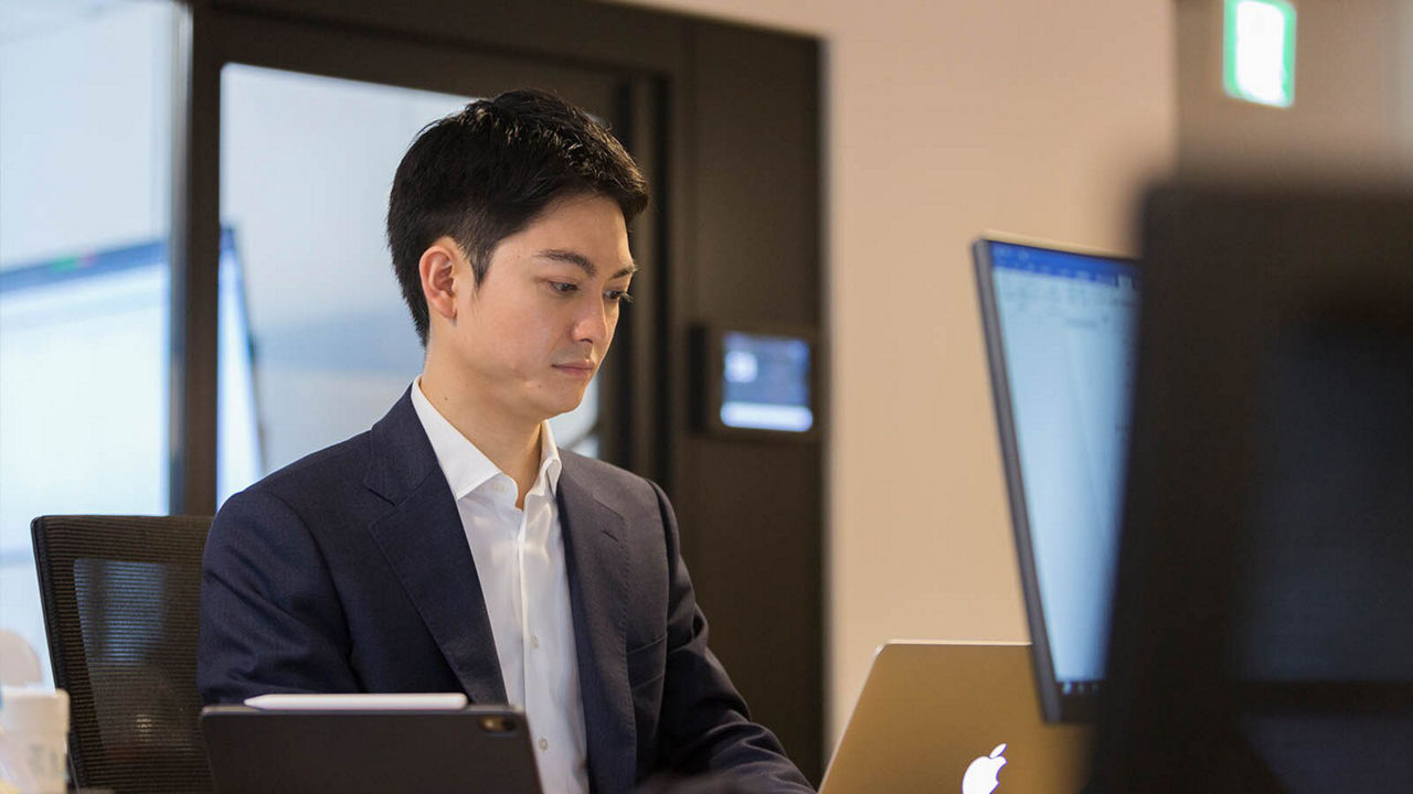 Retsu Kitagawa with a laptop