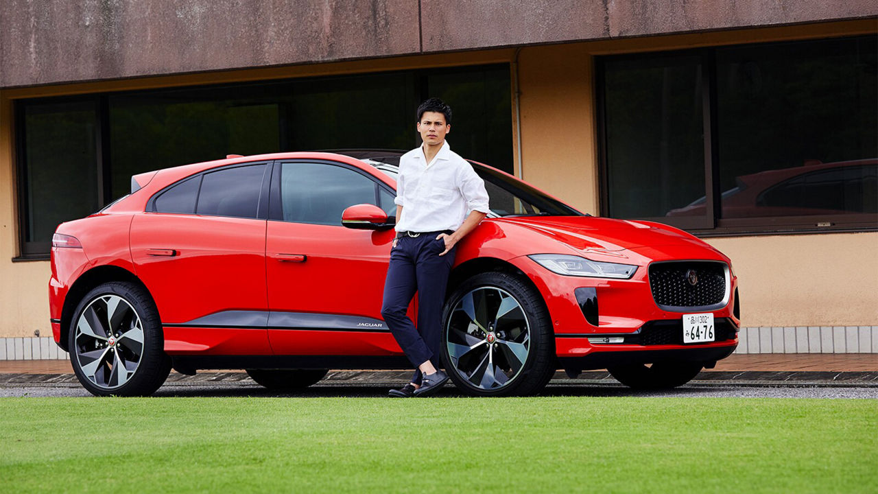 Ryo Miyaichi in front of a Jaguar I-Pace