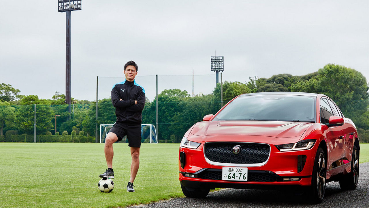 Ryo Miyaichi in front of a Jaguar I-Pace