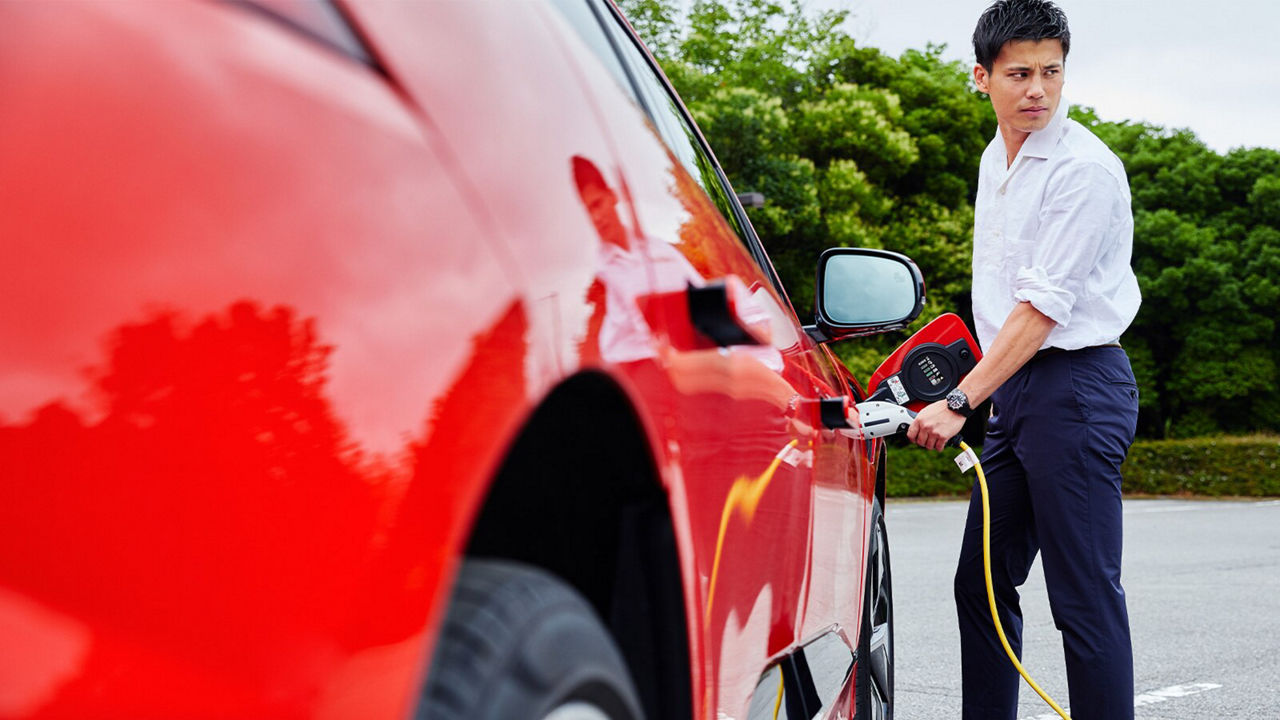 Ryo Miyaichi is charging a Jaguar I-Pace