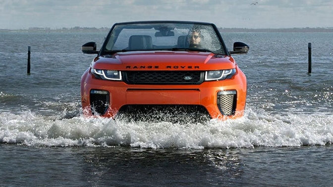 Range Rover Evoque driving through water 