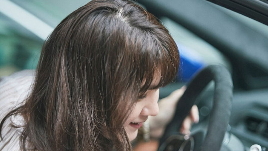 woman driving JAGUAR