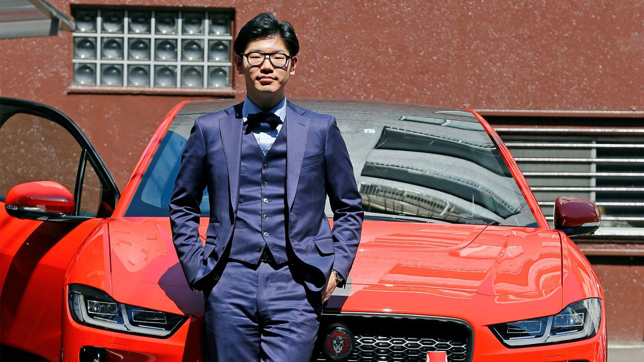 Yukitaka Yoshikawa in front of a Jaguar I-Pace