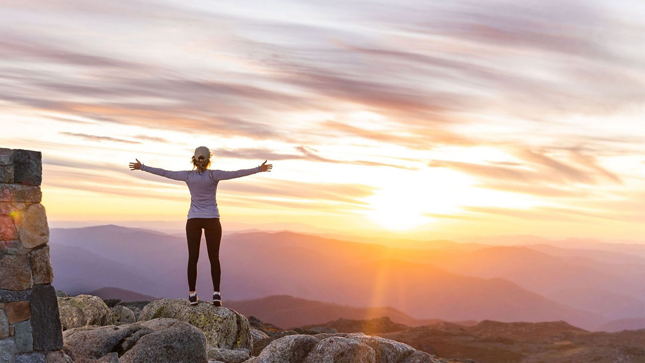 A lady enjoying the sunrise 