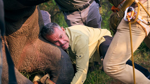 Man holding rhino leg 