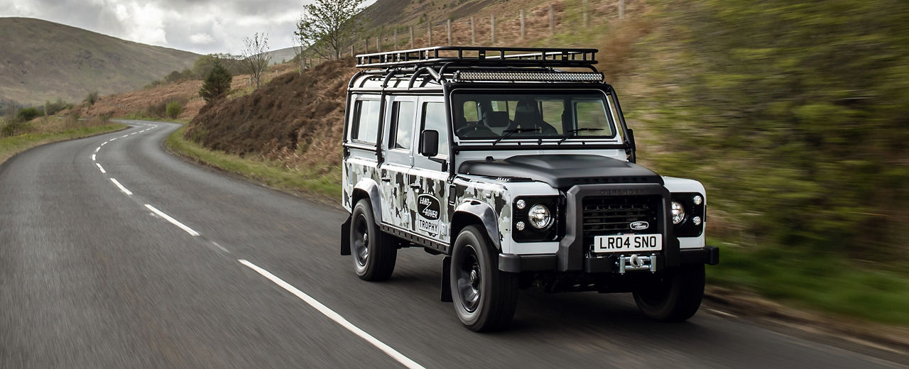 Defender Classic driving along a country road