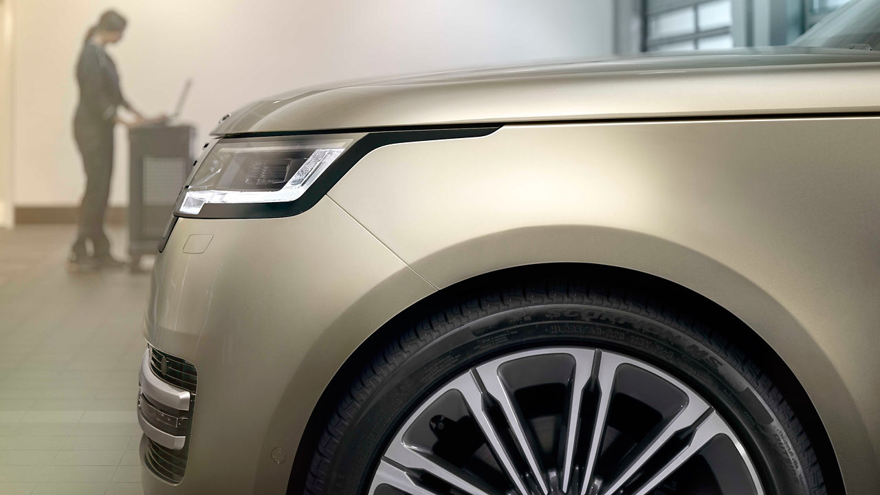 Range Rover zoom side view with female model