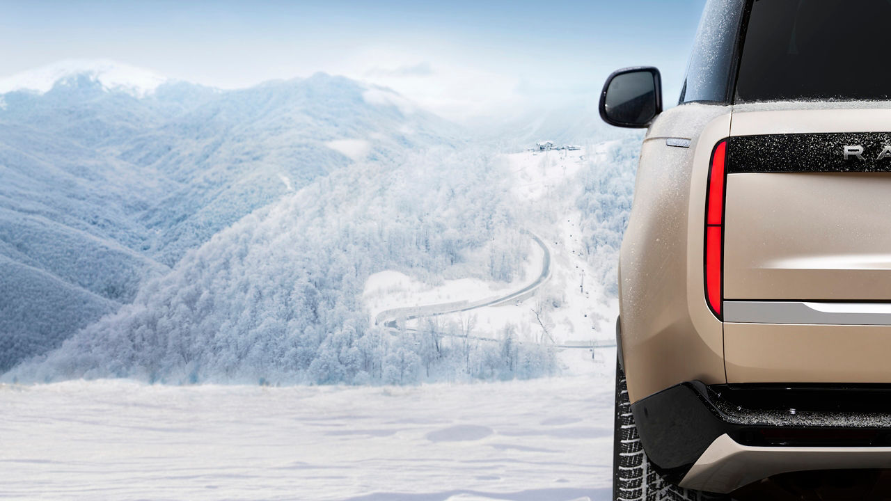 Range Rover on snow-covered ski slopes.