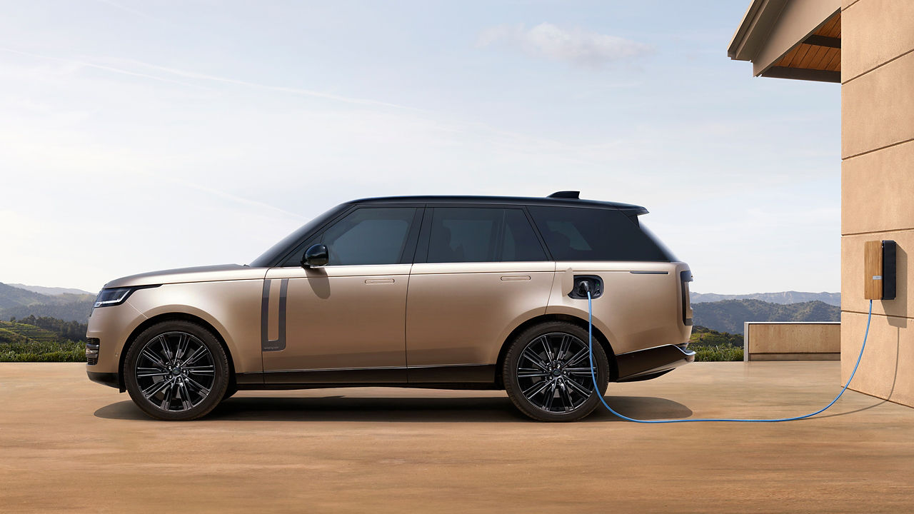 Range Rover at an EV charging station