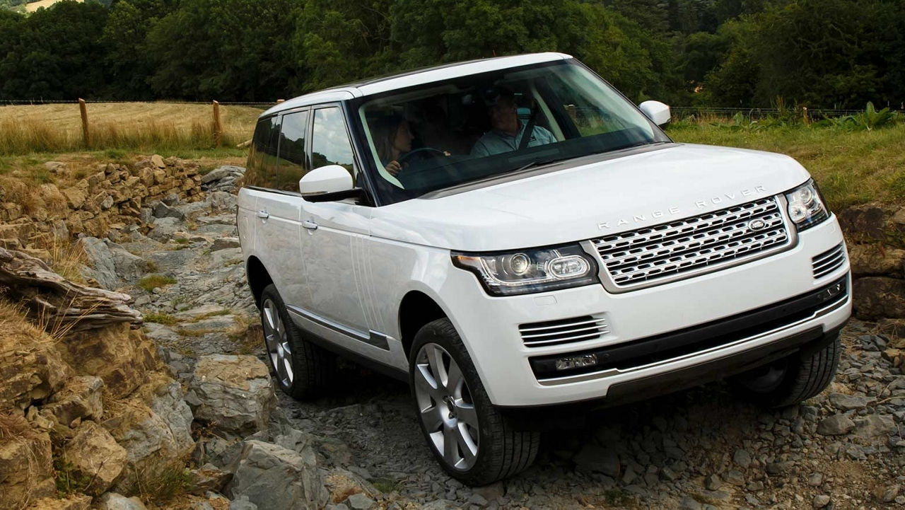 2018 Range Rover driving up a rocky incline