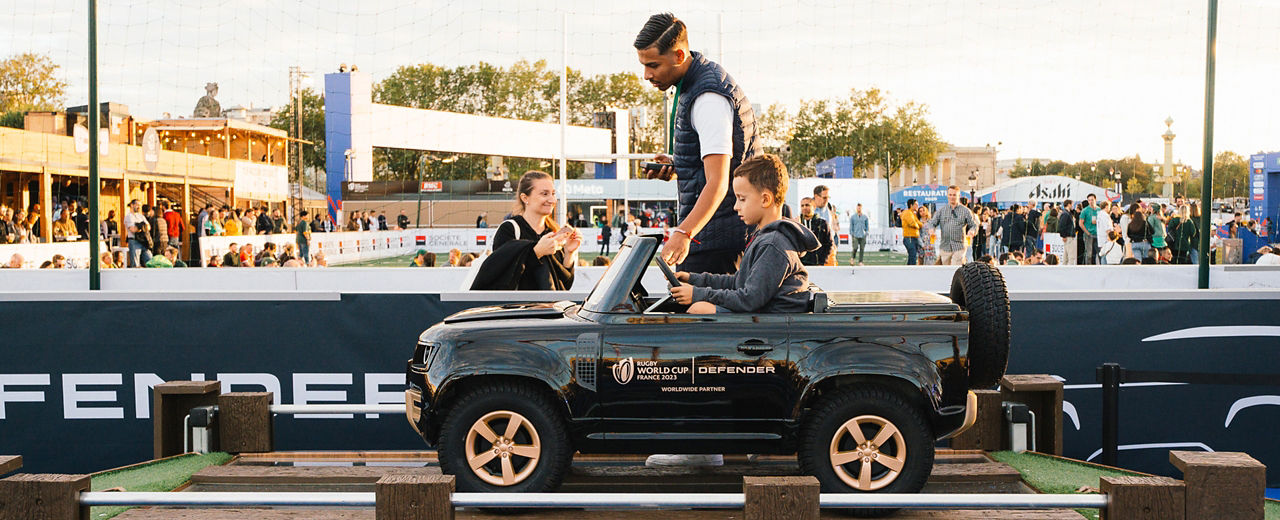 Child in Small Defender with Rugby World Cup branding